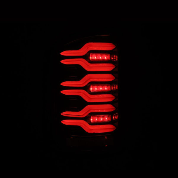 AlphaRex 14-18 GMC Sierra 1500/2500HD/3500HD LUXX-Series LED Tail Lights Alpha-Blk Actv Lgt Seq. Sig